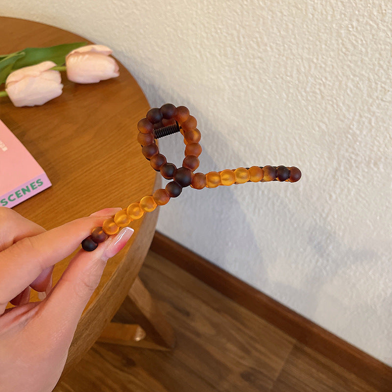 Clips de maintien de tête arrière transparents