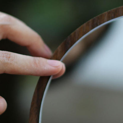 round wooden mirror