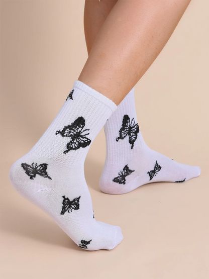 Chaussettes mi-longues noires et blanches à motif papillon