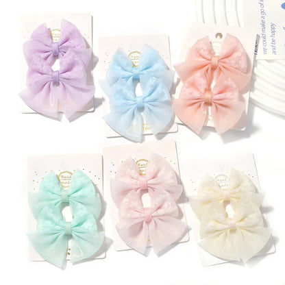 Mini nœuds pour cheveux en coton doux pour bébé.